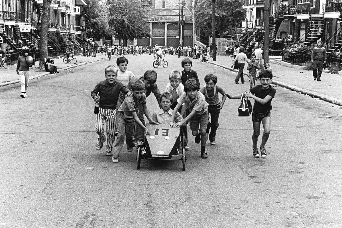 Roger Charbonneau, <i>Soapbox race on Sheppard Street in the Hochelaga-Maisonneuve neighbourhood</i>, Montreal, 1975, from the series <i>Montreal’s Working-Class Neighbourhoods</i>, gelatin silver print (27.9 × 35.5 cm), collection of the artist