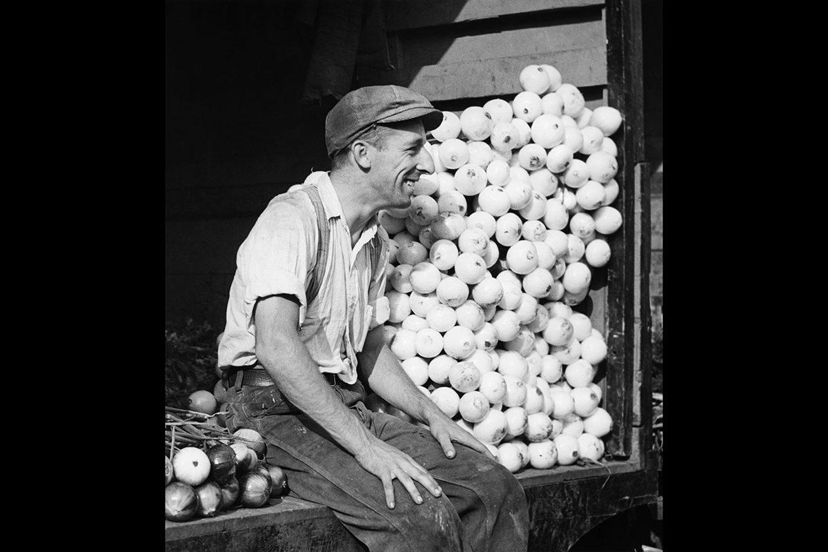 Paul-Marc Auger, <i>Man Selling Onions, Market at Jacques Cartier Square, Montreal</i>, about 1940. Gift of Carl Auger, M2004.69.32, McCord Museum
